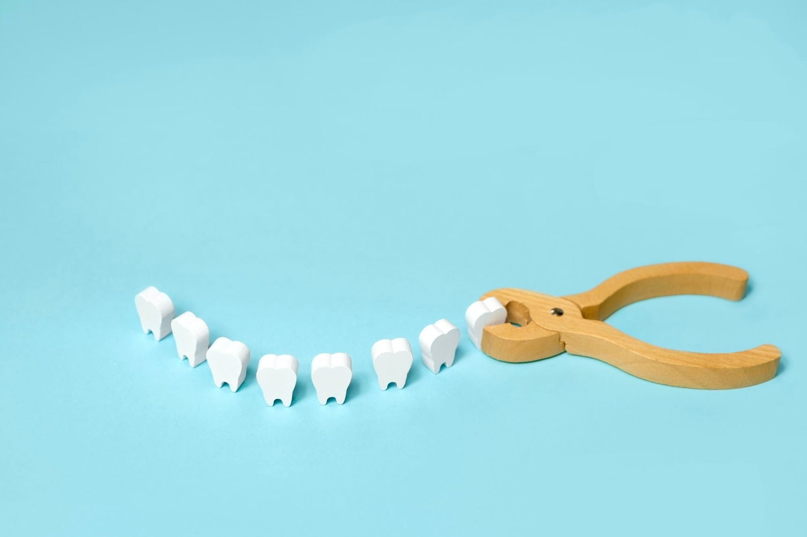 Tooth extraction with a dental instrument with forceps.